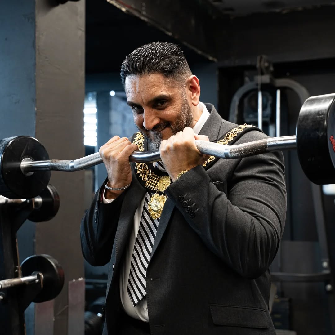 The Mayor lifting weights at Iron World Gym